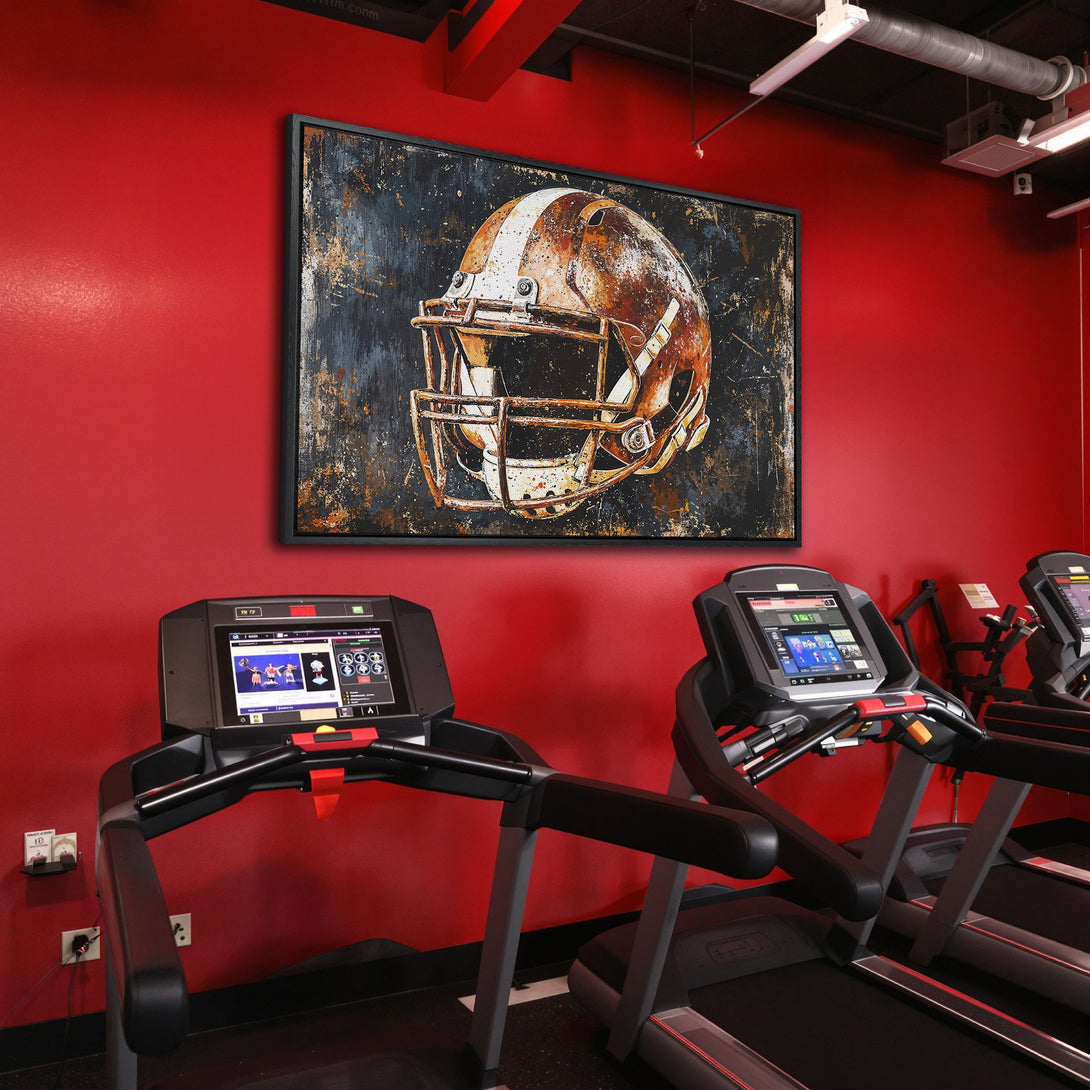 Framed Wall Art: Football helmet canvas print in a gym setting. Rustic style, featuring a brown, white, and blue color palette. Elevate your space!