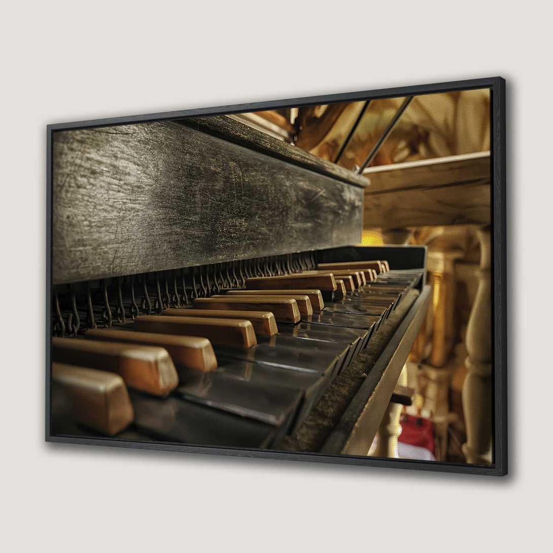Framed Wall Art: Antique piano keys. Rustic, vintage style with warm brown and black tones. Perfect for adding character to your home.