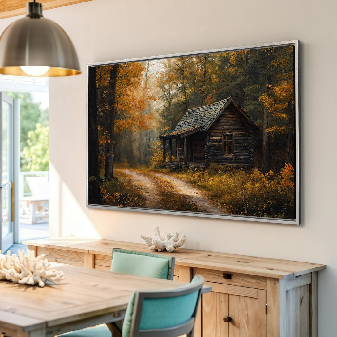 Framed Wall Art: Rustic cabin scene in a forest, warm autumn color palette. Bring the cozy charm of nature into your home with this beautiful art.