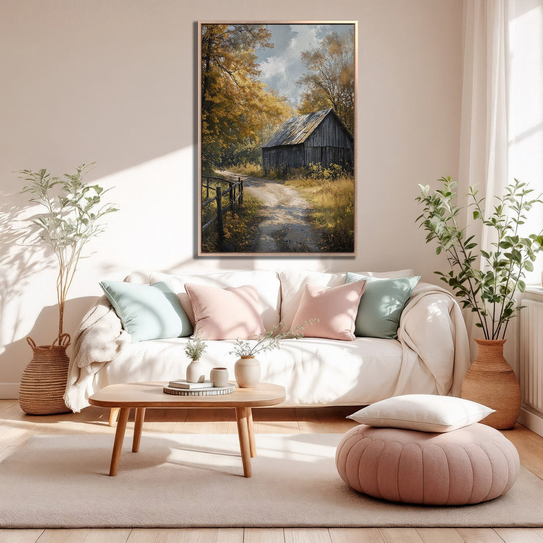 Framed Wall Art of a rustic barn scene in warm, autumnal tones. Perfect for adding cozy charm to your living room!
