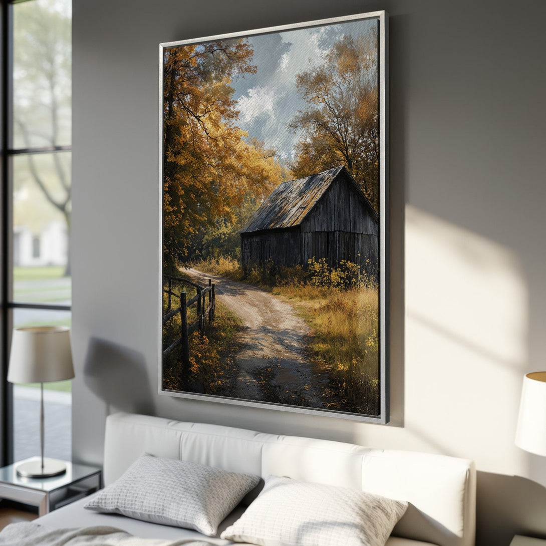 Framed Wall Art: Rustic barn scene in warm autumn colors. Landscape Canvas Print with golden leaves and inviting dirt road, perfect for cozy decor.