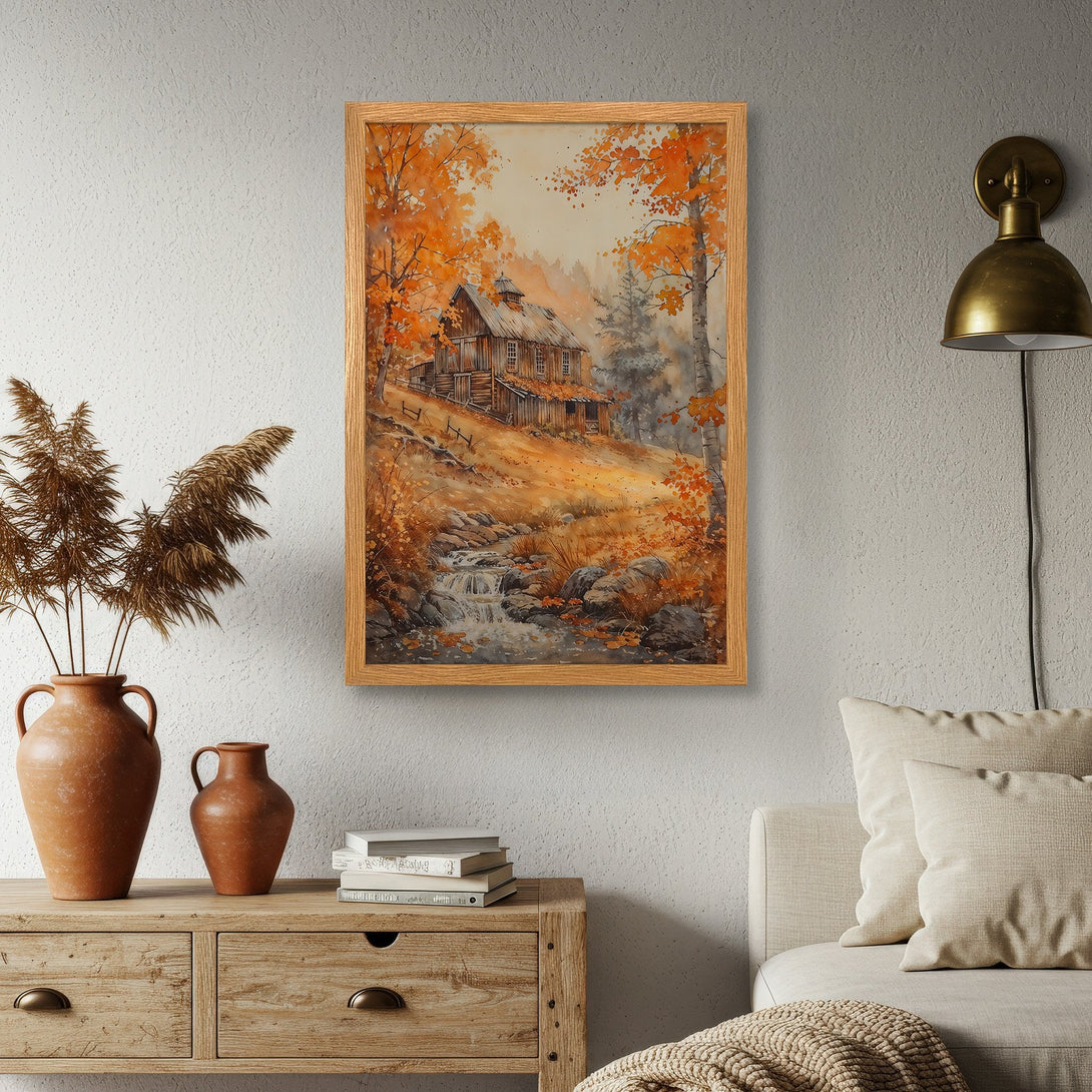 Framed Poster of a watercolor painting of a cabin in autumn. Warm orange & brown color palette. Perfect wall art for cozy decor.