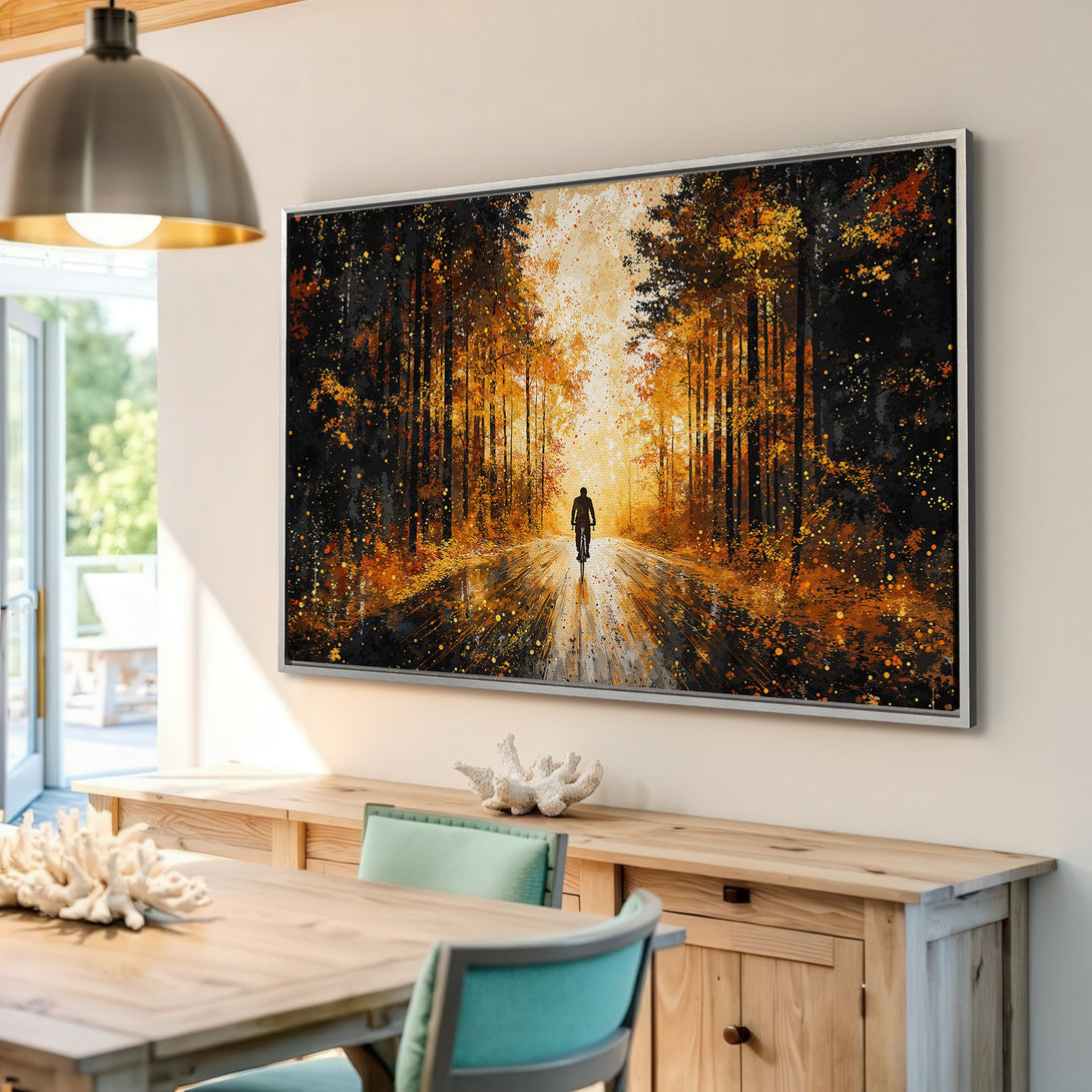 Framed Wall Art: Cyclist in golden forest. Abstract painting with warm orange & black hues. Modern canvas print for home decor.