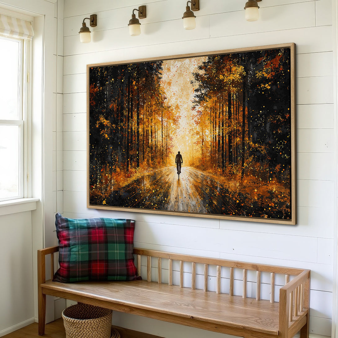 Framed Wall Art: Abstract forest scene with cyclist, warm orange and black color palette. Perfect for living room or entryway decor.