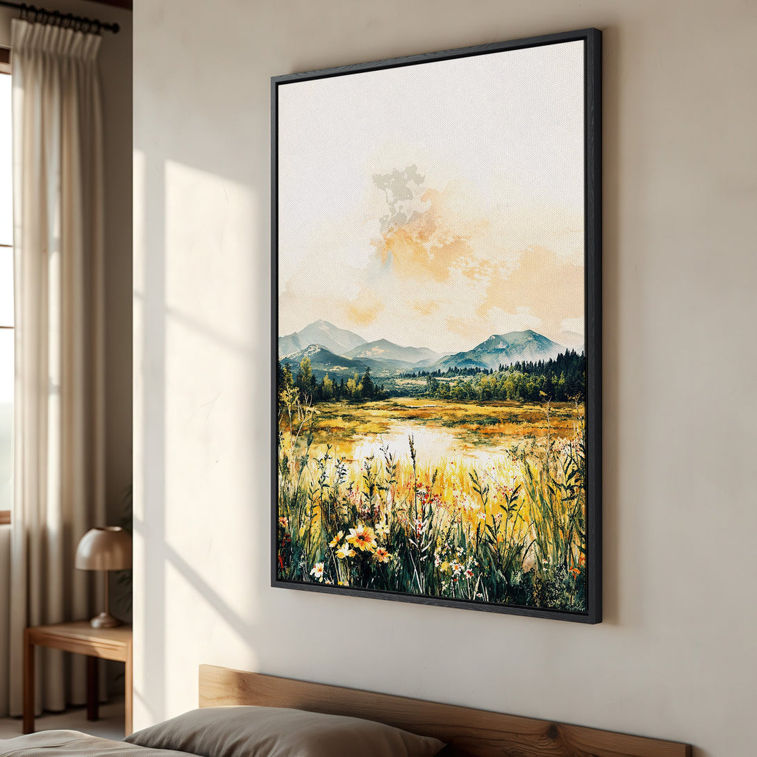 Framed Wall Art: Watercolor landscape Canvas Print with mountains, lake, and wildflowers. Warm yellow, green, and blue tones create a serene, nature-inspired aesthetic.