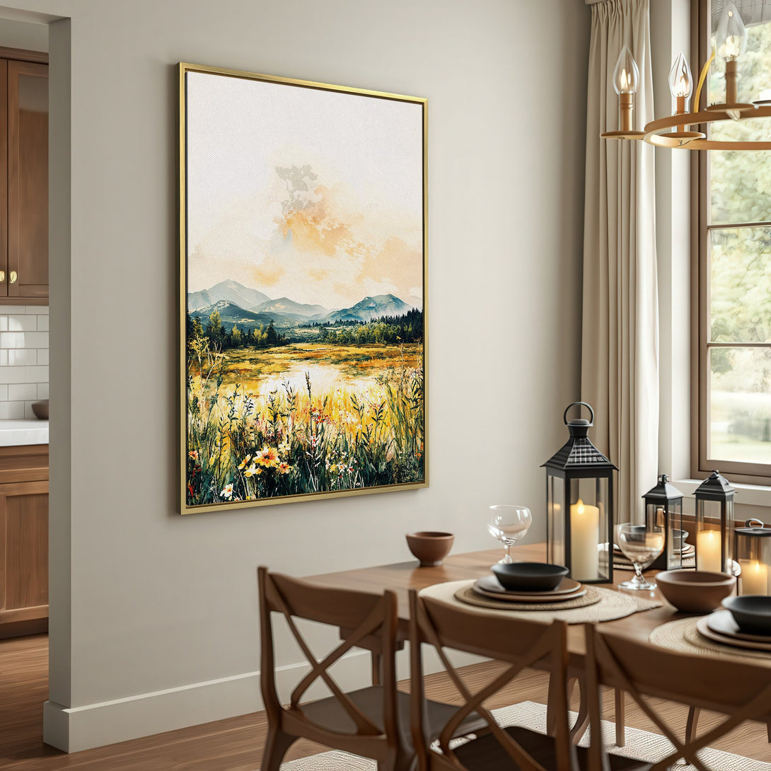 Canvas Print of a watercolor landscape with mountains, fields, and warm yellow tones, displayed in a rustic interior setting.
