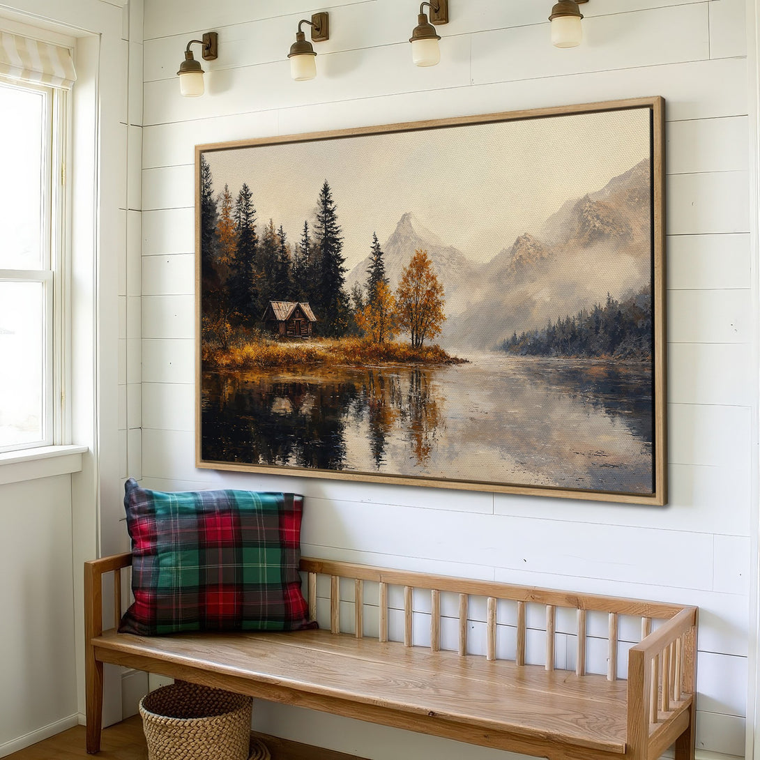 Framed Wall Art: Landscape painting of a cabin by a lake with mountains, featuring a warm, muted color palette. Perfect for rustic home decor.