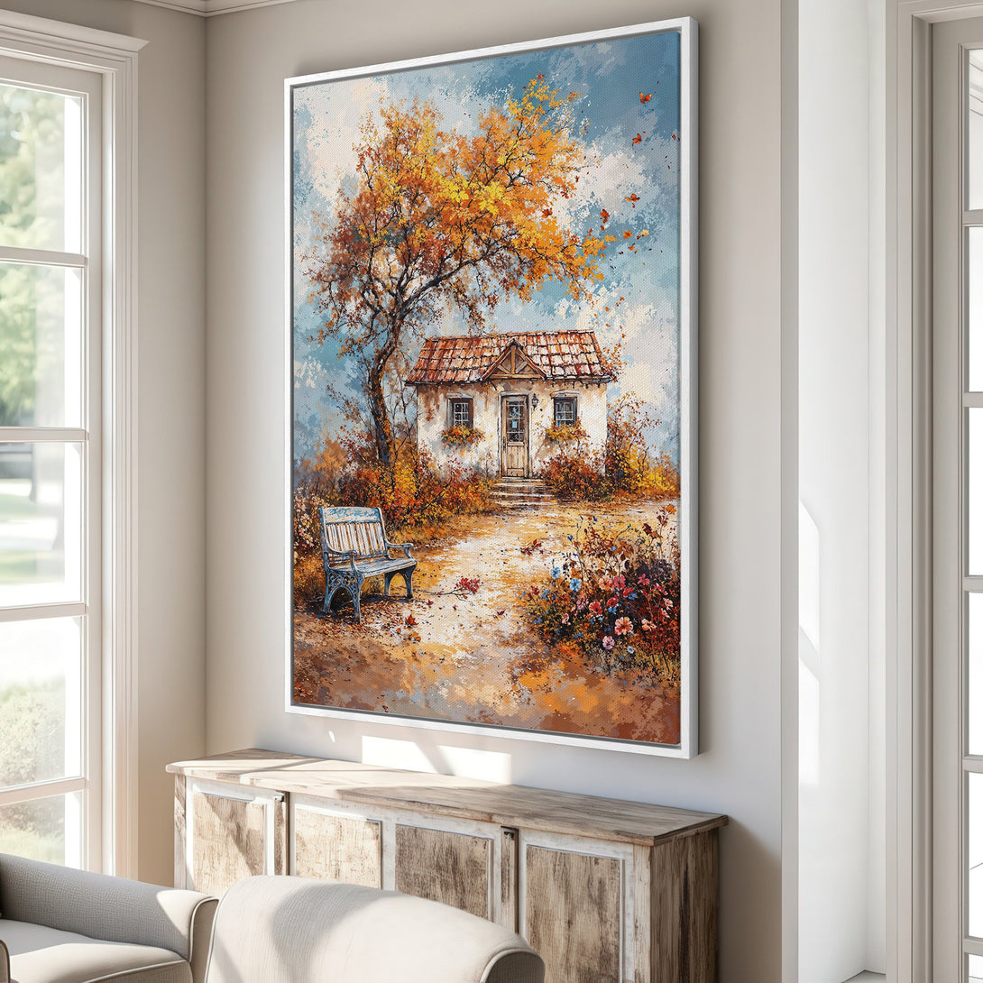 Framed Wall Art: Autumn cottage scene in warm orange, yellow, and blue hues. Beautiful landscape painting perfect for adding cozy vibes to your home.