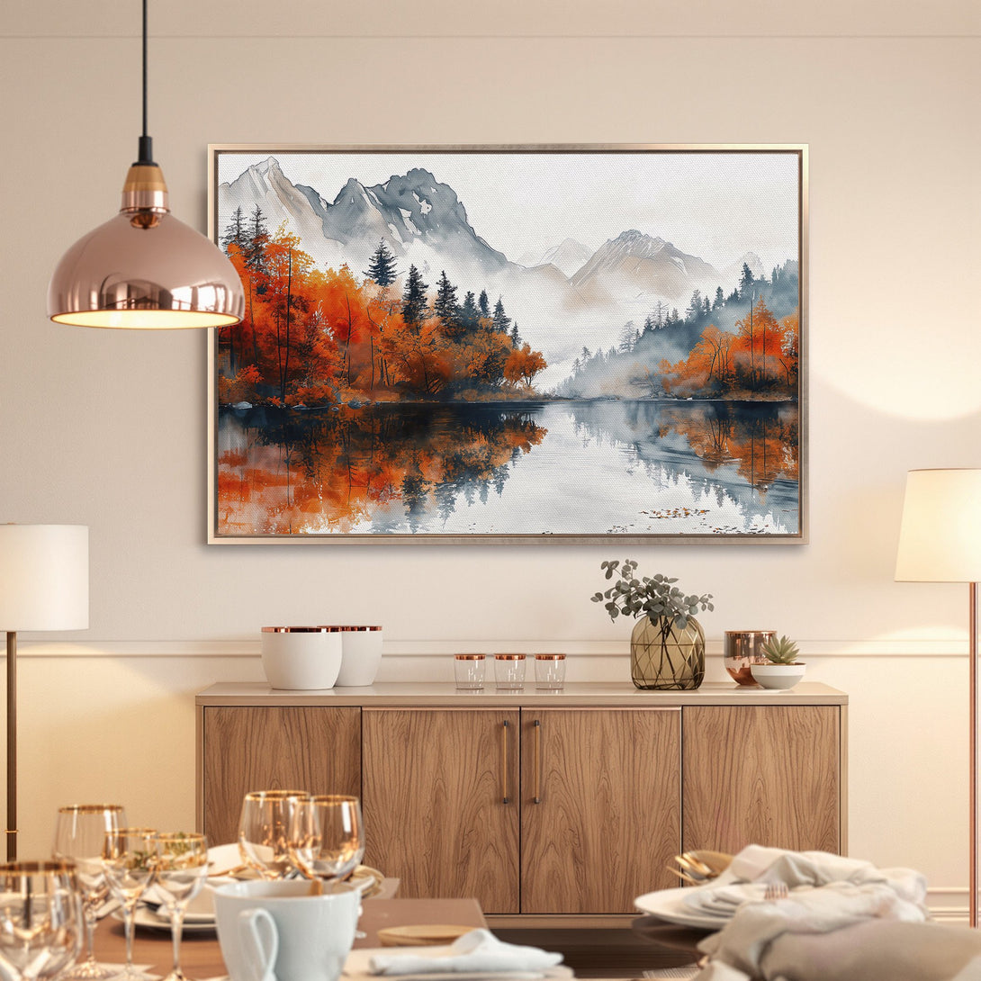 Framed Wall Art: Serene lake landscape in watercolor style. Features autumn colors of orange & blue, perfect for adding a calming touch to any room.