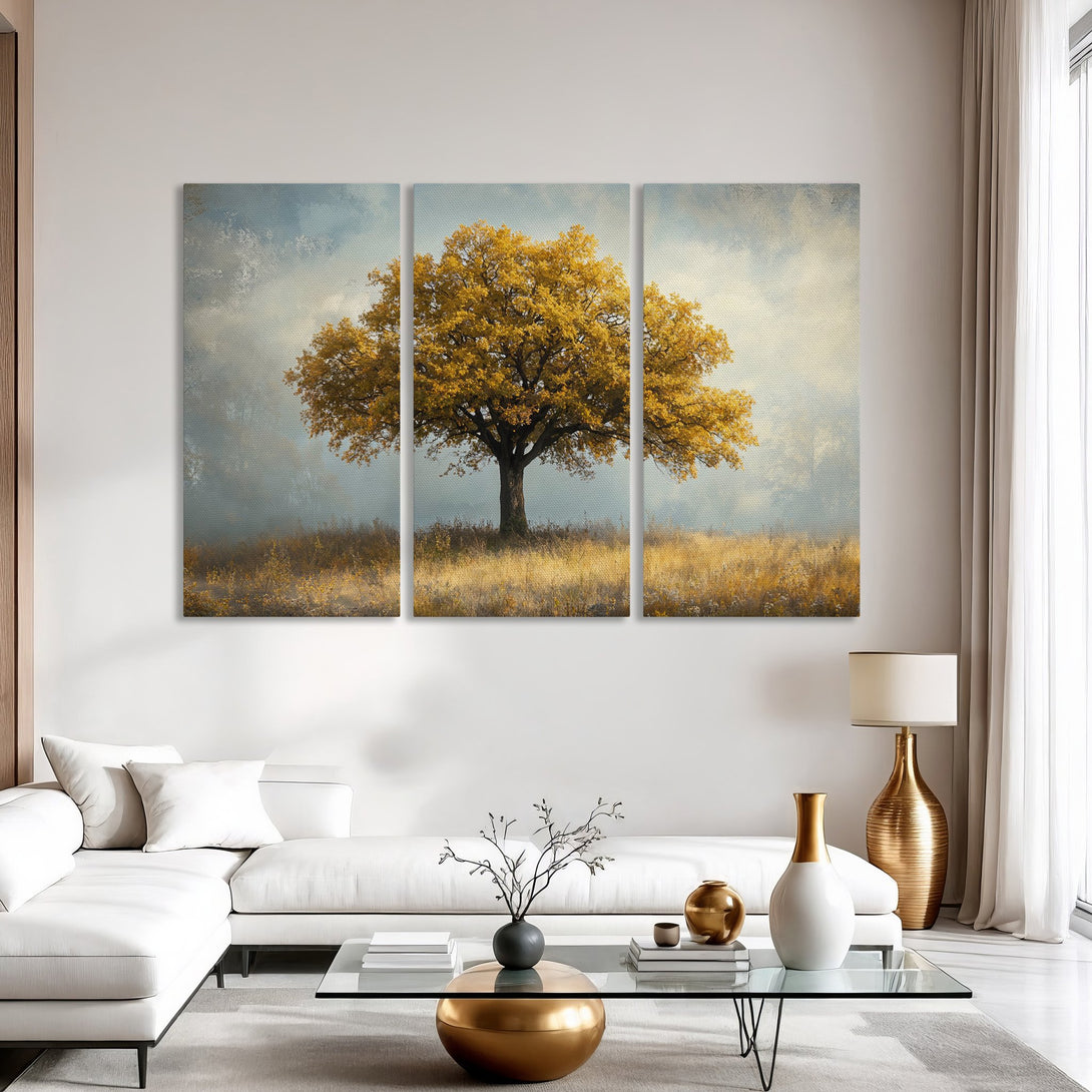 Canvas Print of a majestic tree in a field, warm yellow and gold tones, perfect for modern living room decor.