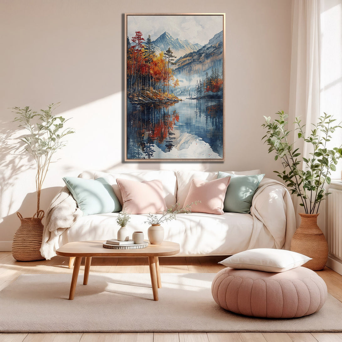 Framed Wall Art: Watercolor landscape Canvas Print in a living room. Features a tranquil lake scene with fall colors and a blue/orange/white palette.