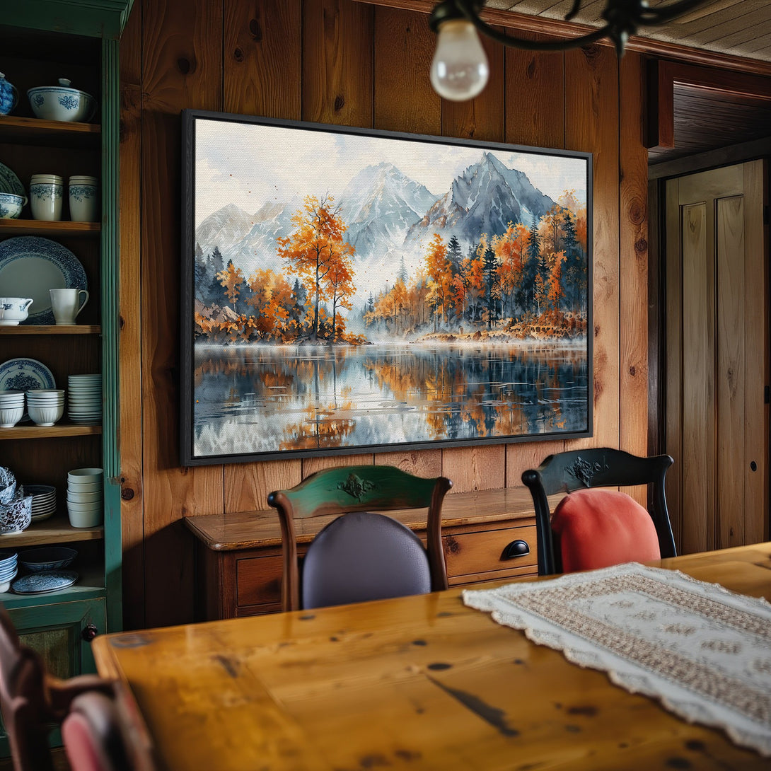 Framed Wall Art: Serene mountain lake scene in watercolor style. Earthy tones of orange, blue, and gray create a calming, natural aesthetic. Perfect for any room.