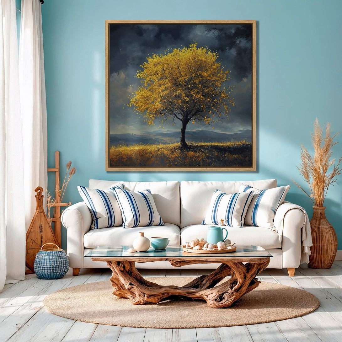 Framed Wall Art: Stunning landscape Canvas Print of a golden tree against a moody sky. Earthy tones & blue accents create a serene, stylish interior.