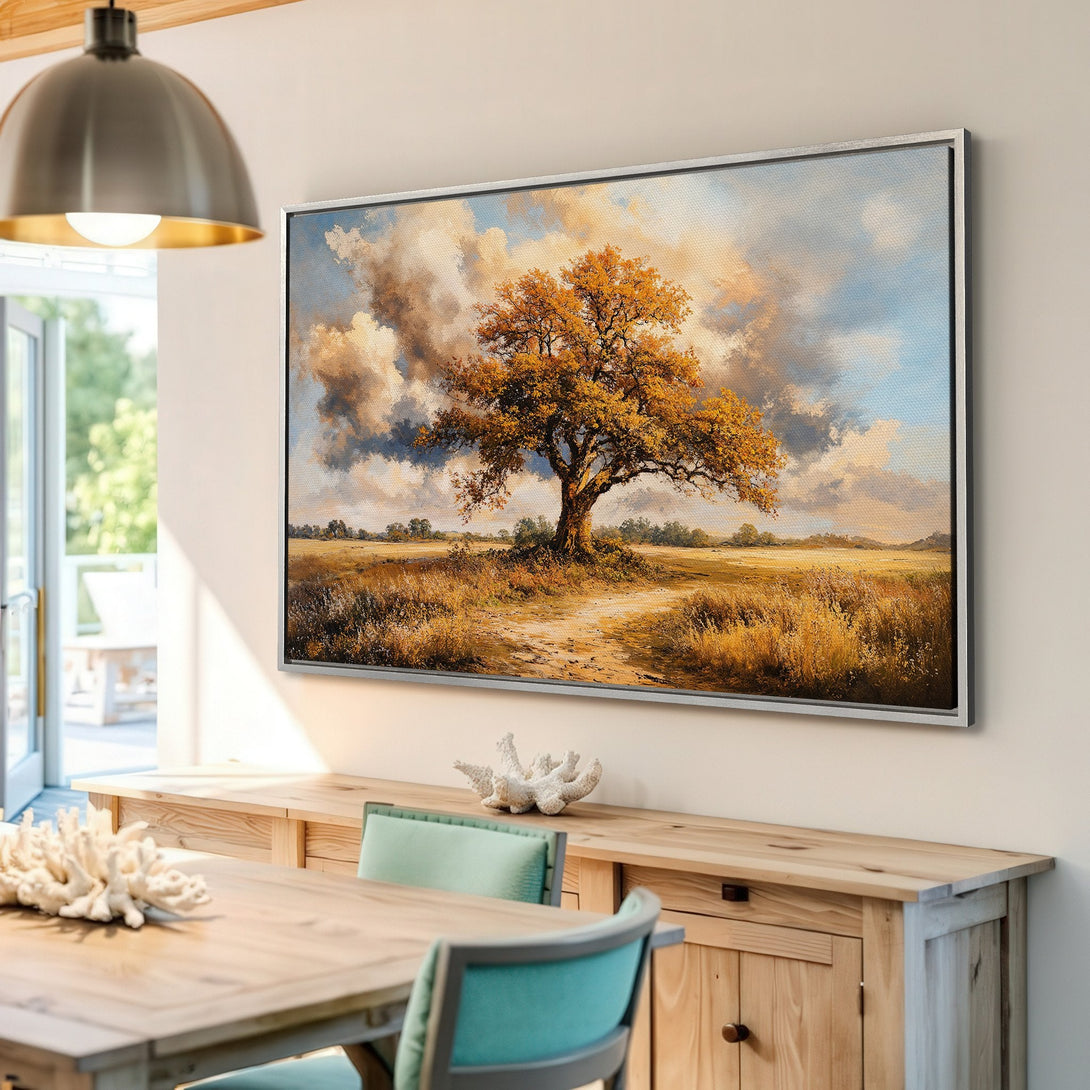 Framed Wall Art of a majestic tree in a field, painted in a warm, impressionistic style with a golden and blue color palette. Perfect for any home!