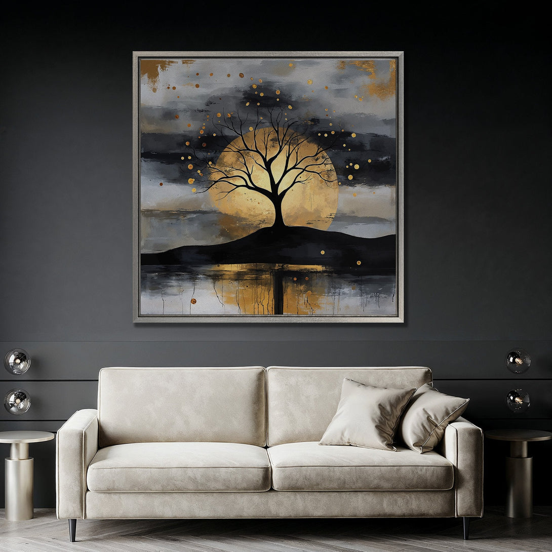 Framed Wall Art featuring a serene tree silhouette against a golden moon. Modern abstract style with a black, gray, and gold color palette. Perfect for home decor.