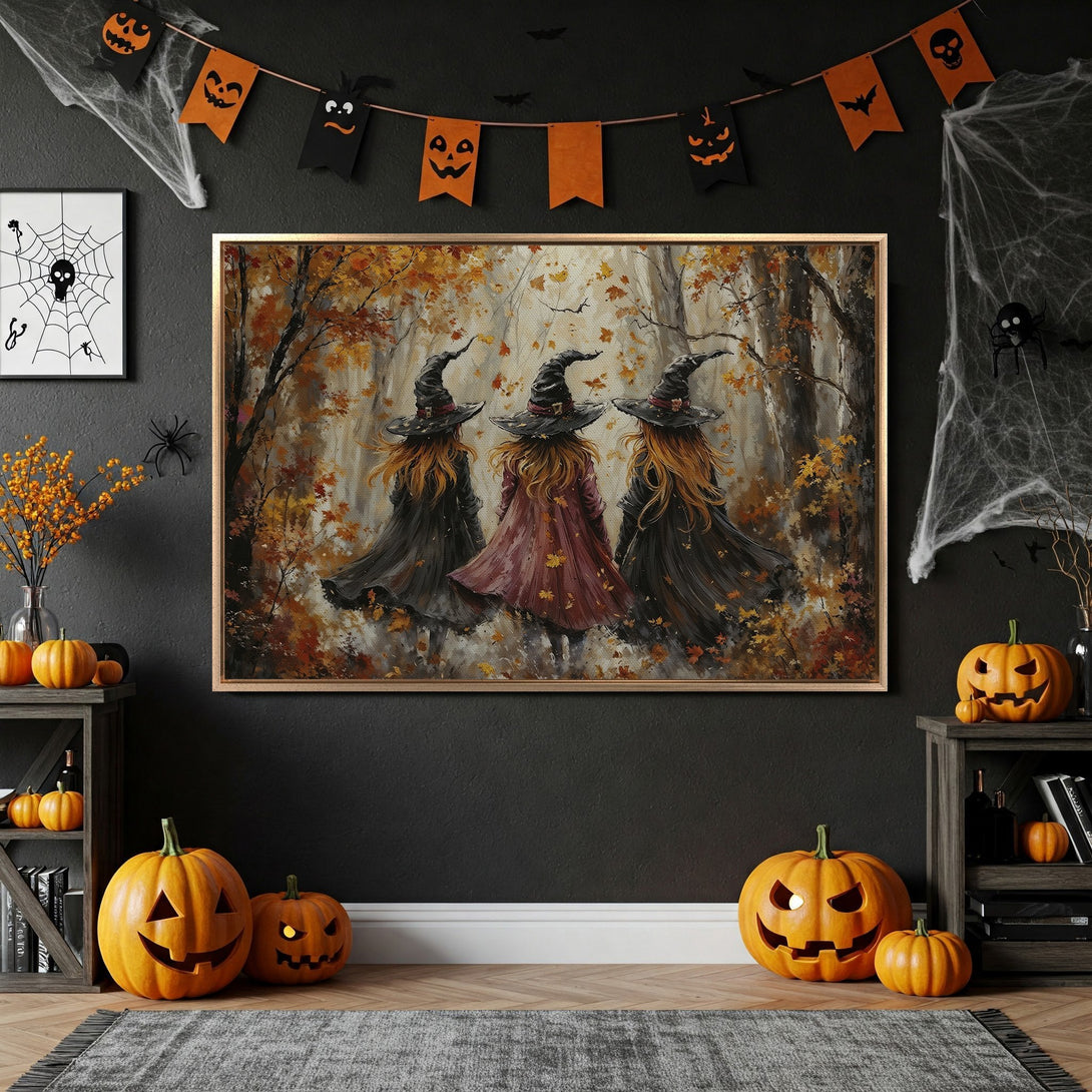 Framed Wall Art: Halloween-themed canvas print featuring three witches in a forest with a warm, autumnal color palette. Perfect for spooky season decor!