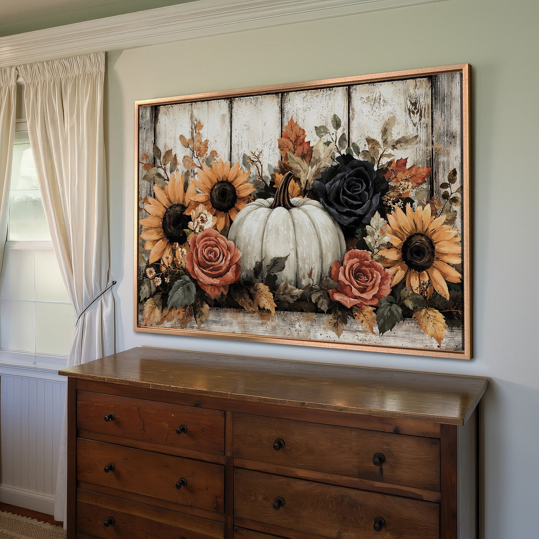 Framed Wall Art: Rustic fall floral print with pumpkin, sunflowers, and roses. Warm color palette of oranges, browns, and blacks. Perfect autumn decor.