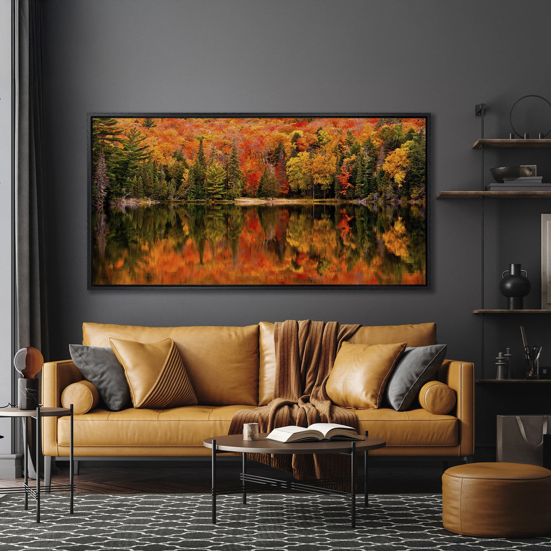 Framed Wall Art: Stunning autumn landscape Canvas Print with vibrant orange and green hues, displayed in a modern living room. Elevate your space!