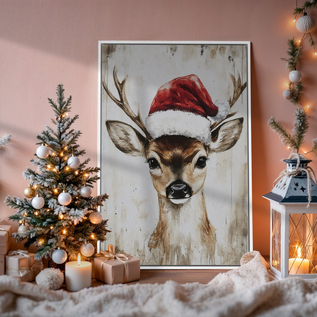Framed Wall Art: Watercolor deer in Santa hat. Warm, neutral tones create a cozy Christmas vibe. Perfect holiday decor for your home.