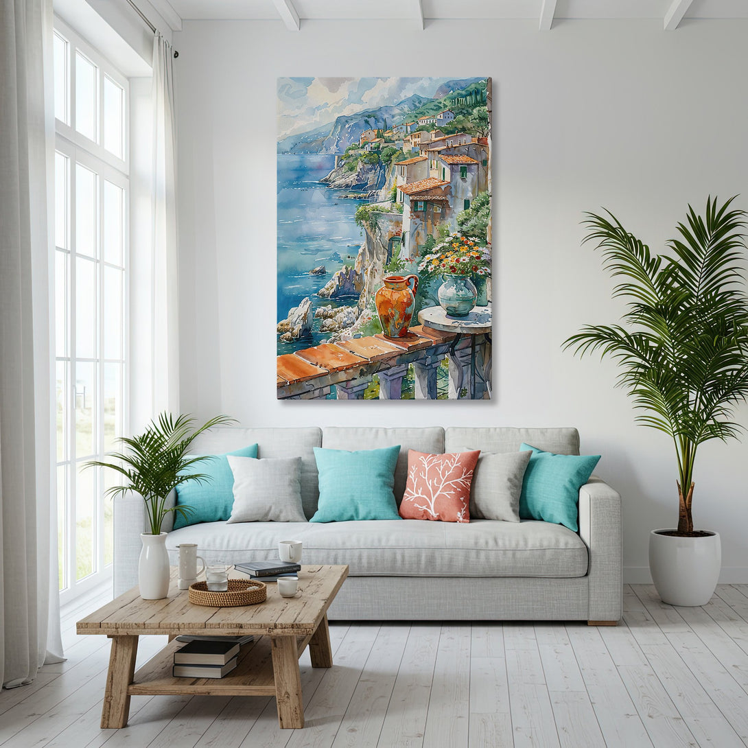 Framed Wall Art featuring a coastal village watercolor painting with blue, orange, and green hues, displayed in a bright, modern living room setting.