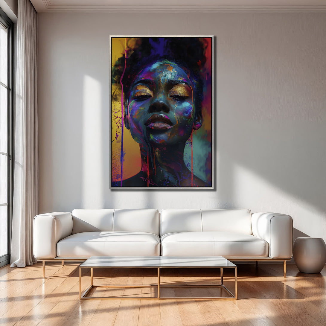Framed Wall Art featuring a vibrant, abstract portrait of a woman with a colorful, expressionistic style. Bold blues, purples, and golds pop against a neutral interior.