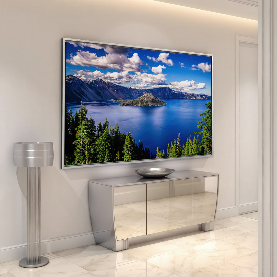 Framed Wall Art featuring a stunning landscape of a lake and mountains. Vibrant blue, green, and white color palette adds a touch of nature to any space.