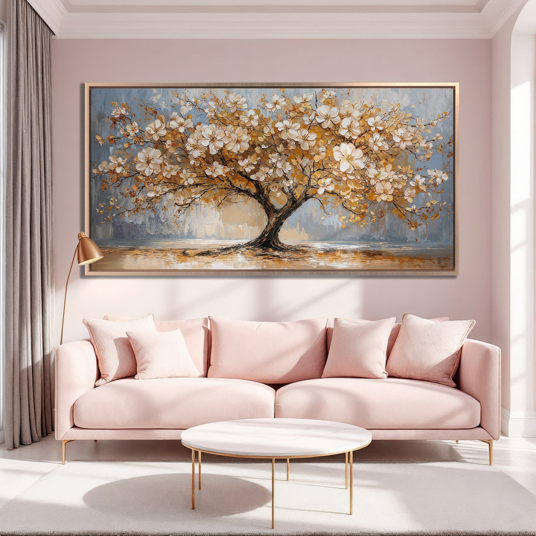 Framed Wall Art of a blossoming tree in a warm, inviting interior. Soft pastel color palette with gold accents. Perfect for adding elegance to any space.