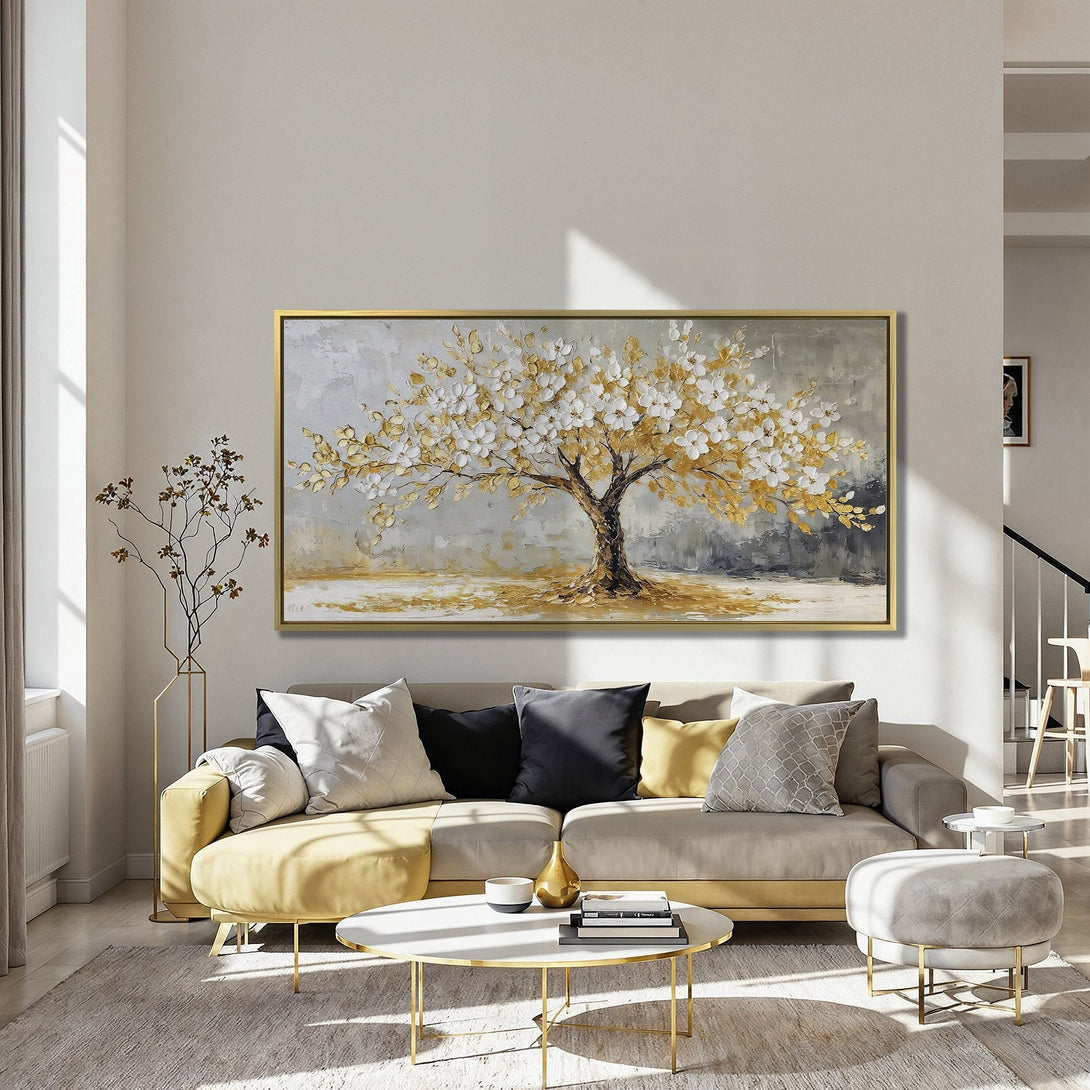 Canvas Print of a blossoming tree in gold and white, displayed in a stylish interior. Adds warmth and elegance to any space.