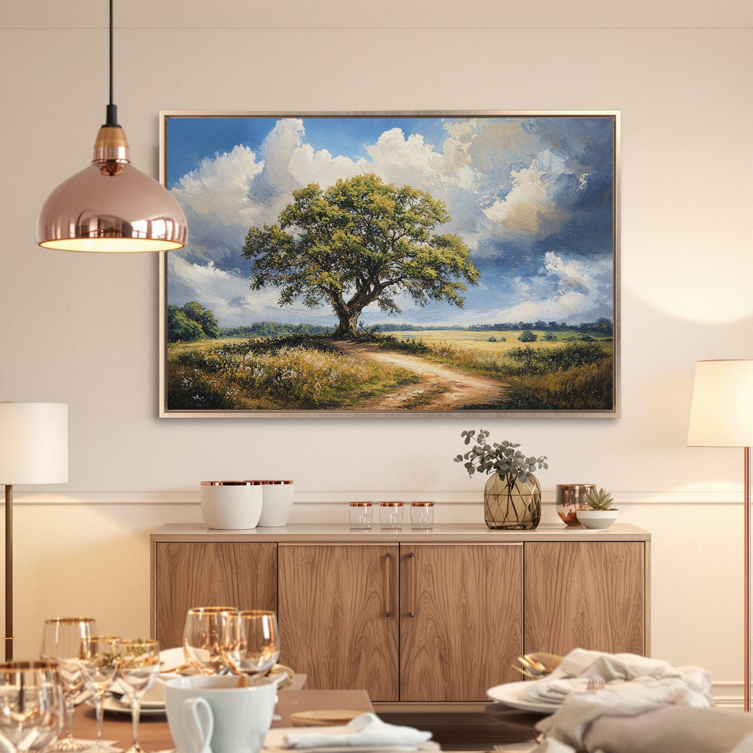 Framed Wall Art: Landscape painting of a tree in a field, featuring a blue sky and warm color palette. Perfect for living room decor.
