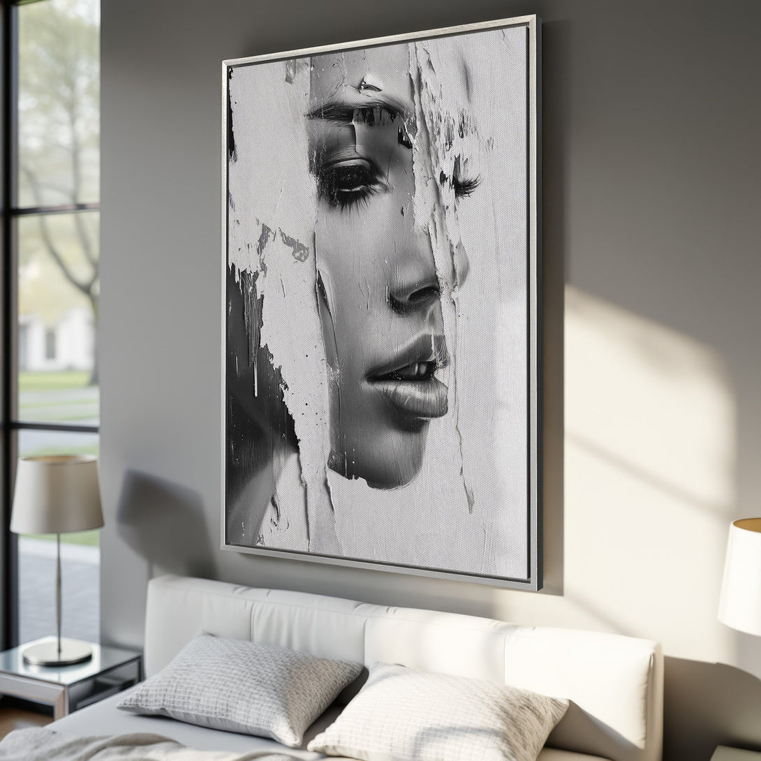 Framed Wall Art: Abstract black and white portrait canvas print. Modern art decor featuring a woman's face in a minimalist bedroom setting.