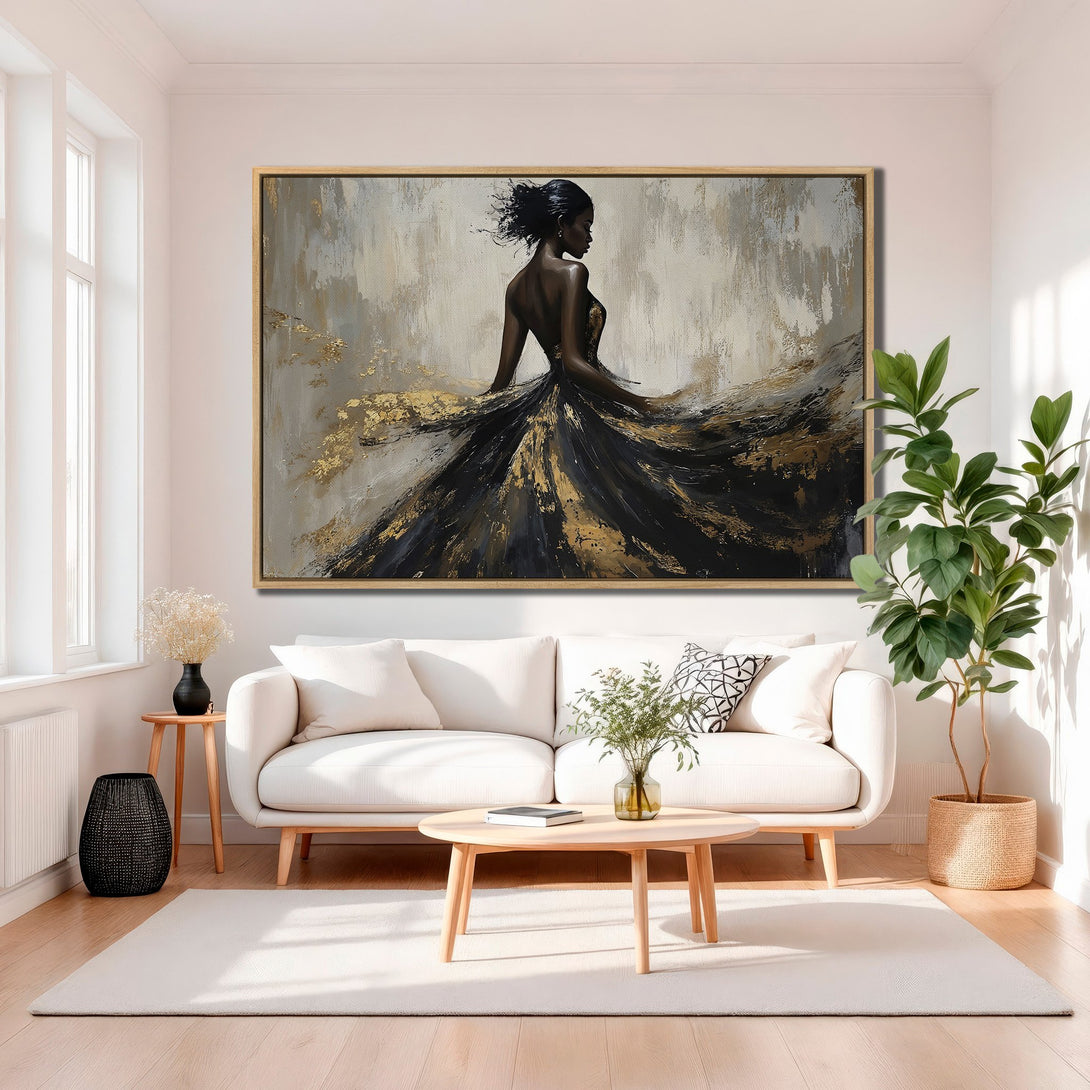 Framed Wall Art featuring an elegant woman in a black and gold dress. Abstract style with a neutral and gold color palette. Perfect for modern home decor.