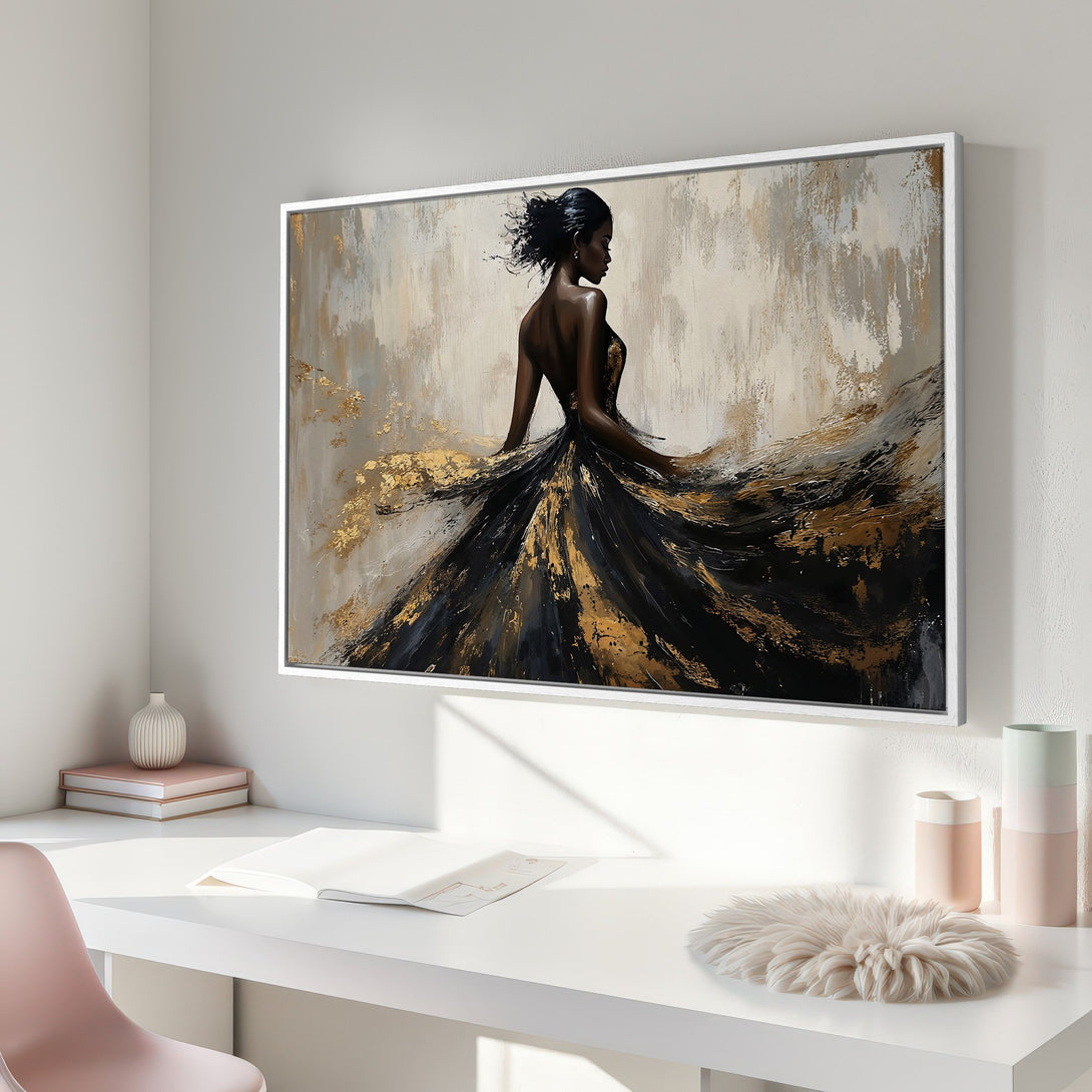 Framed Wall Art featuring a woman in a flowing black and gold dress. Abstract style with a neutral, elegant color palette. Perfect for modern decor.