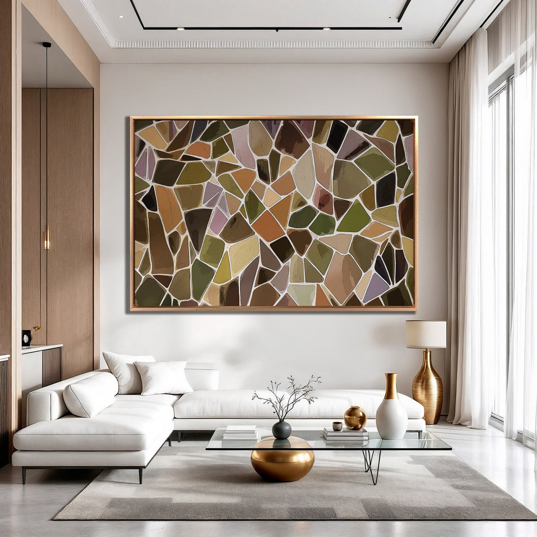 Framed Wall Art featuring abstract geometric design in earthy tones of brown, green, and beige, adding modern style to a living room.