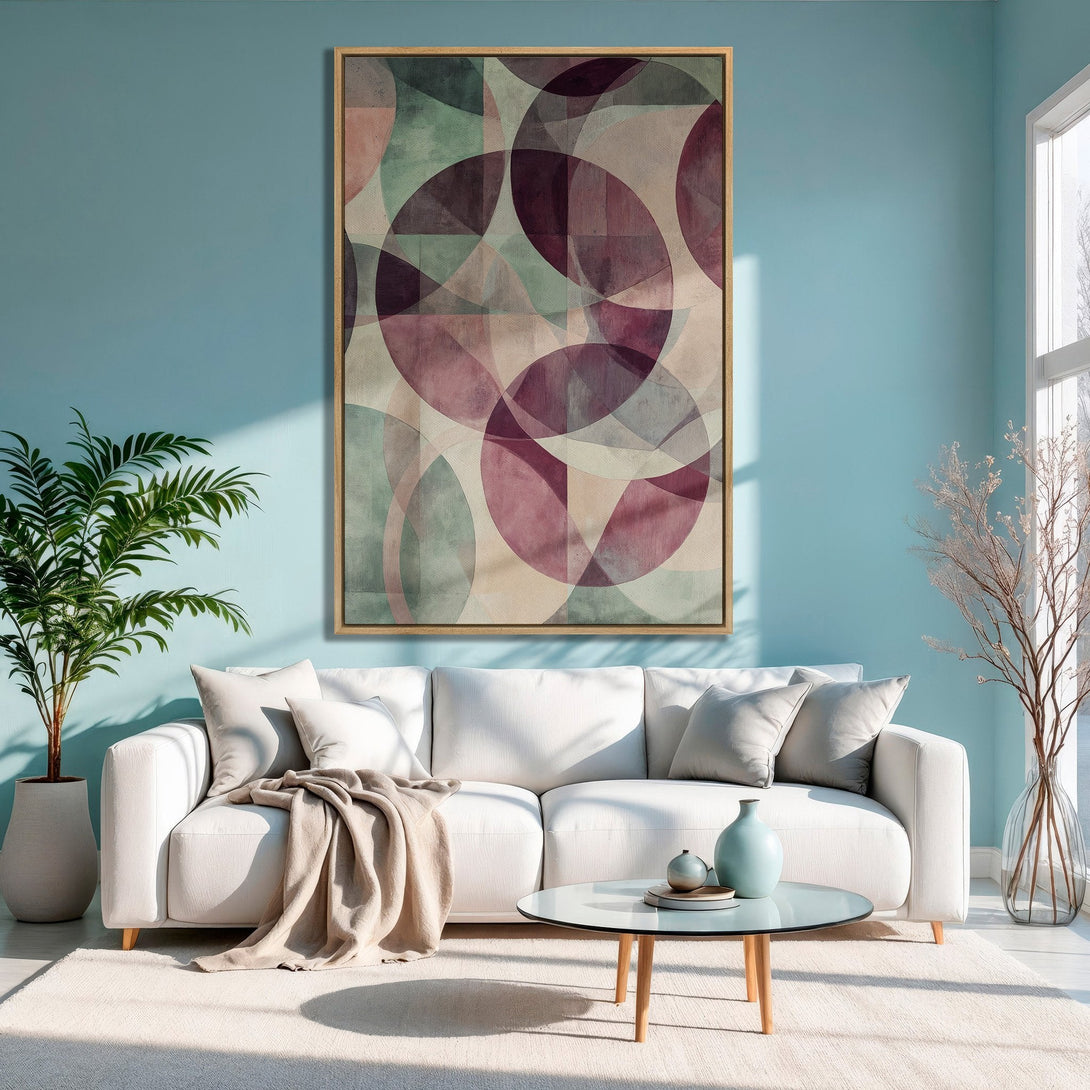 Framed Wall Art featuring an abstract geometric design in a soft, muted color palette of pinks, greens, and beige. Perfect for modern living rooms!