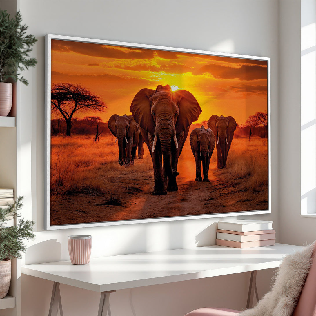 Framed Wall Art: Majestic elephants at sunset. Warm orange and brown tones create a stunning African savanna scene. Perfect for living rooms or bedrooms.