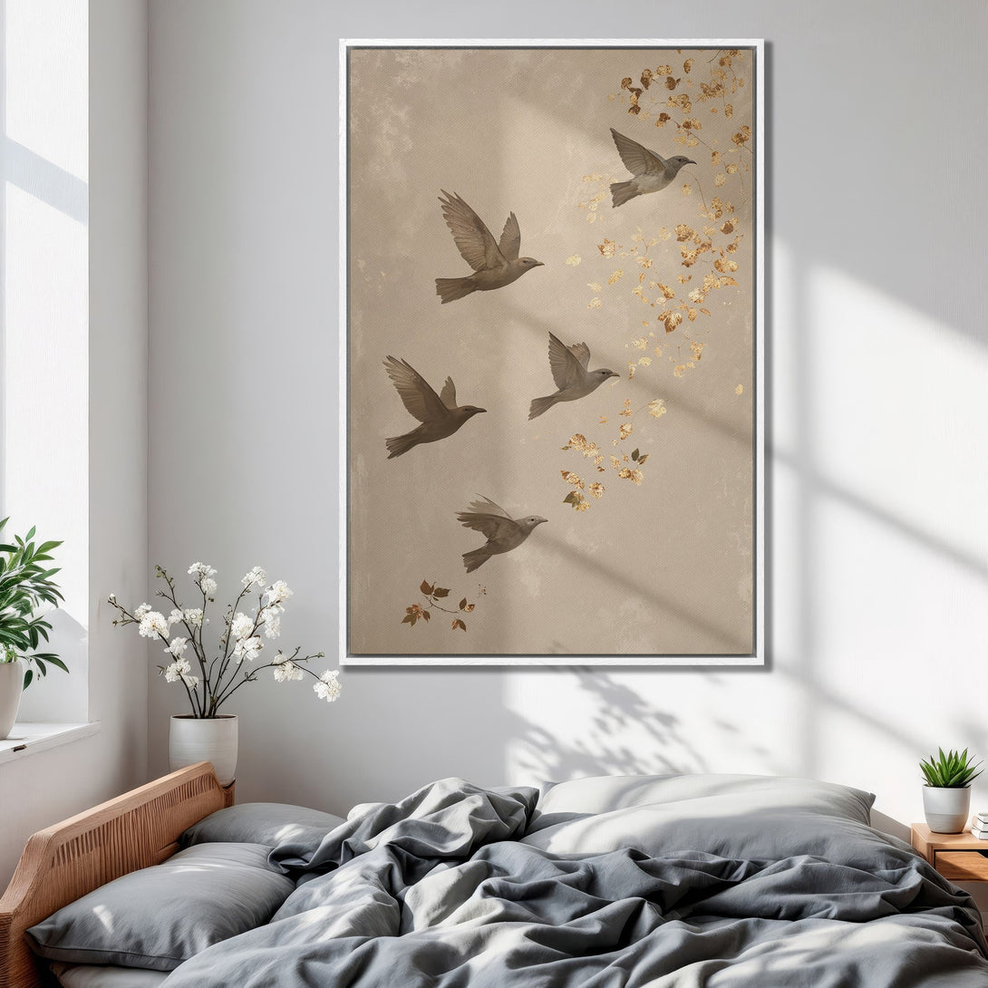 Framed Wall Art of birds in flight with gold accents. Neutral color palette perfect for bedroom decor. Elevate your space with this elegant canvas print.