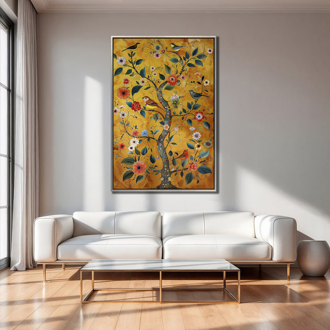 Framed Wall Art: Whimsical tree art with birds & flowers in warm yellow, orange, and green tones. Perfect for adding a touch of nature to your living room.