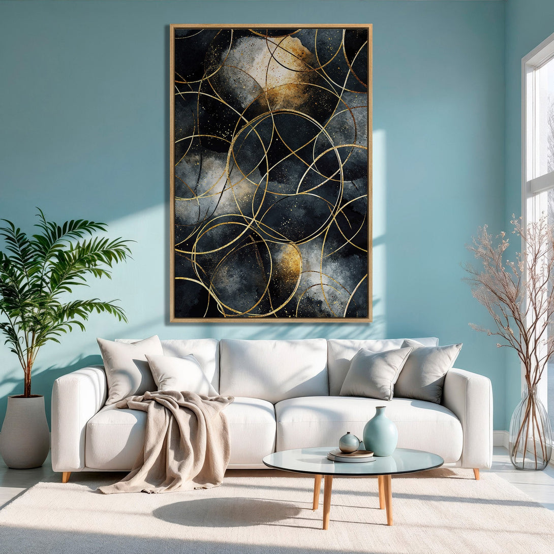 Framed Wall Art featuring an abstract design with gold lines on a dark, moody background. Modern decor in a living room with a teal wall.