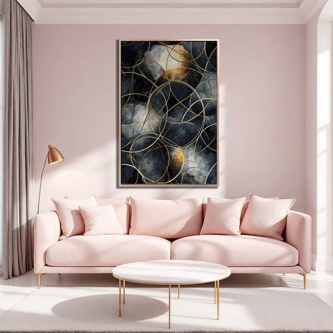 Framed Wall Art: Abstract gold circle design on a dark background. Modern art in a living room with pink and gold accents.