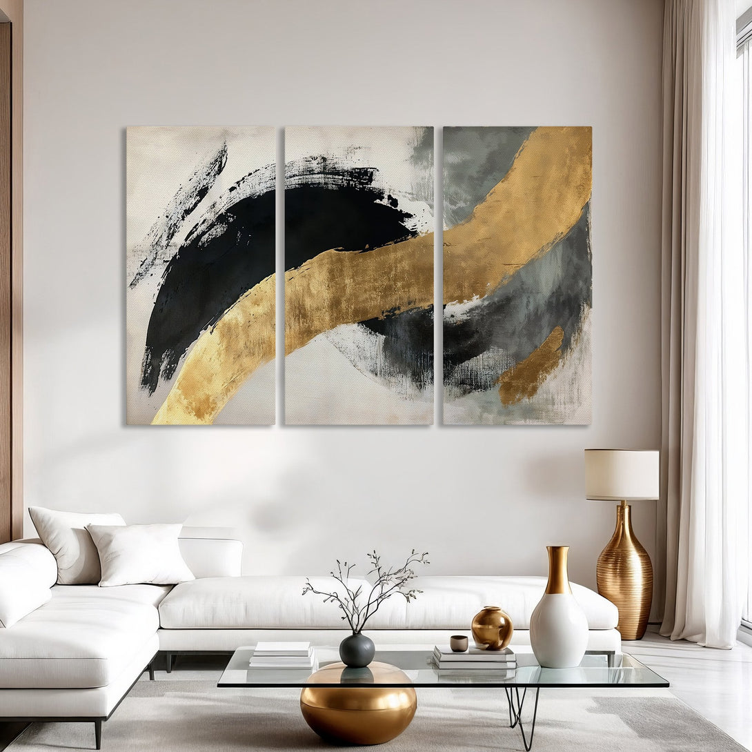 Abstract Canvas Print art in a modern interior. Features gold, black, and gray brushstrokes on a neutral background. Perfect for contemporary decor.