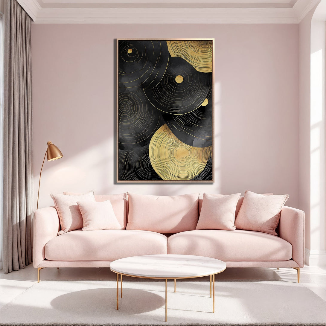 Framed Wall Art featuring abstract gold and black circles. Modern art decor in a pink and gold interior. Elevate your space with this stylish Canvas Print.