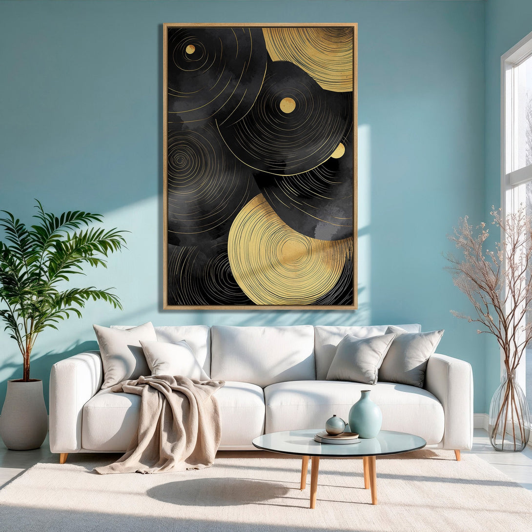 Framed Wall Art: Abstract gold and black circles canvas print in a modern living room with a teal wall. Enhance your decor with this stylish artwork!