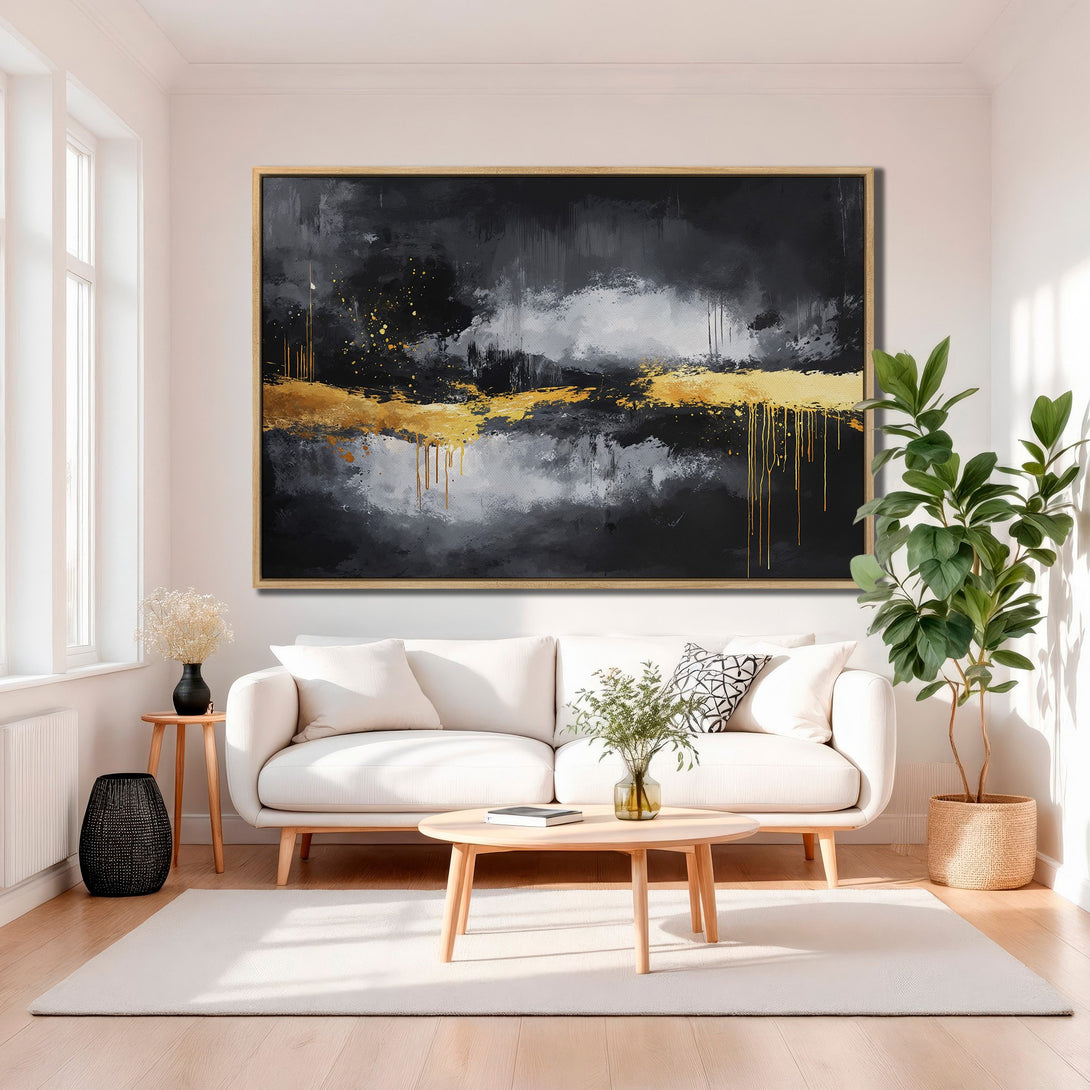 Framed Wall Art abstract painting in a modern living room. Black, gold, and gray abstract art canvas print. Enhance your home decor with this stunning piece.