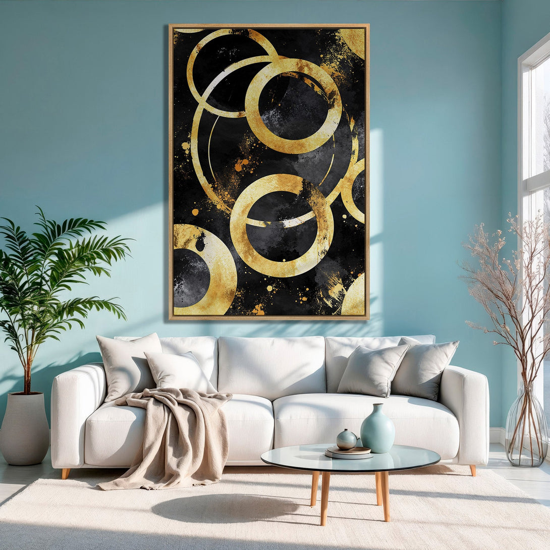 Framed Wall Art: Abstract gold circle art on black canvas. Modern decor with a black, gold, and blue color palette for a stylish interior.