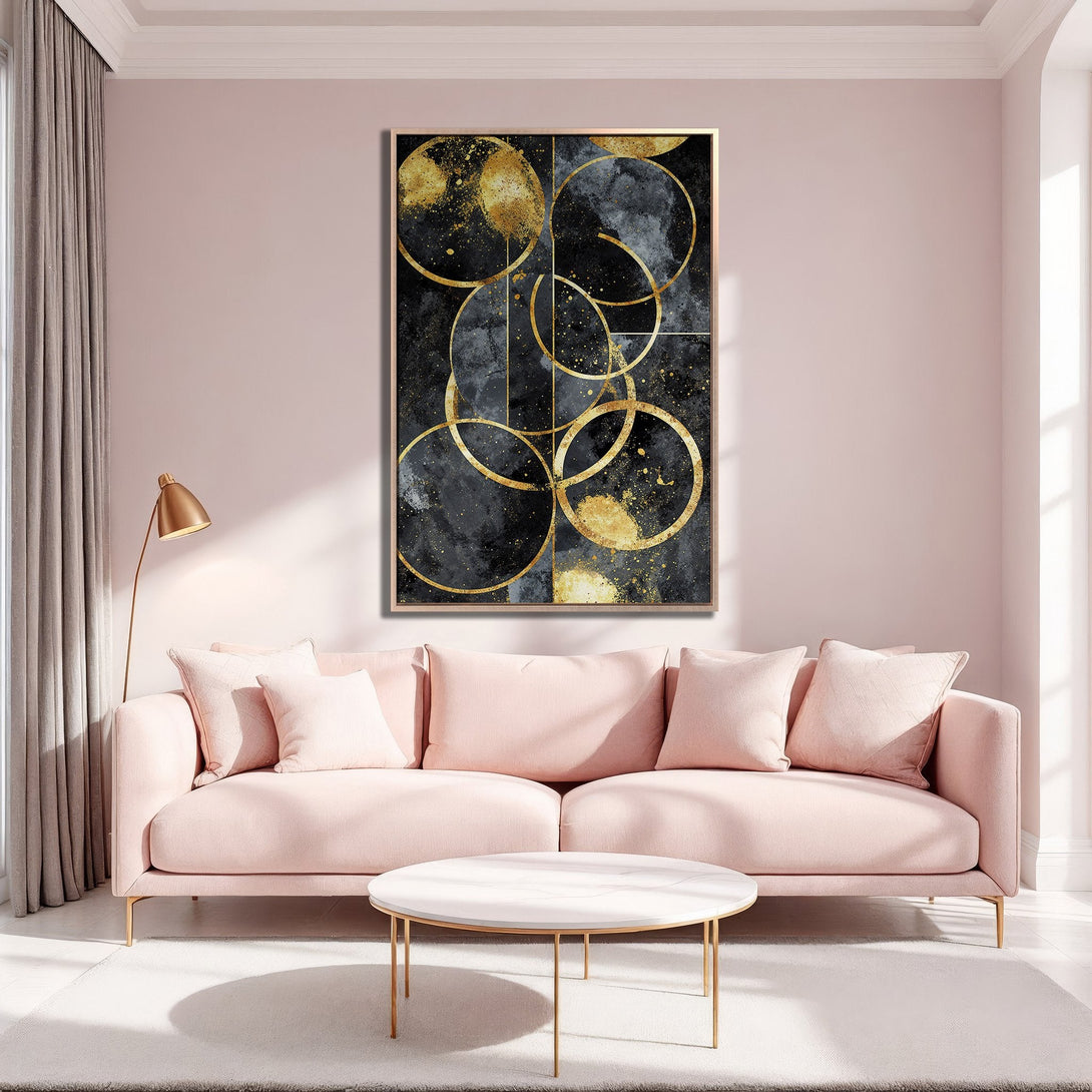 Framed Wall Art: Abstract gold circle design on black canvas. Modern art print in a blush pink interior, perfect for living room decor.