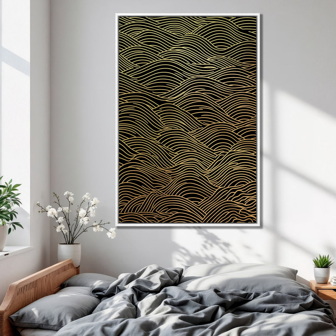 Framed Wall Art featuring a gold wave pattern on black. Modern abstract art in a bedroom setting. Perfect for adding a touch of elegance.