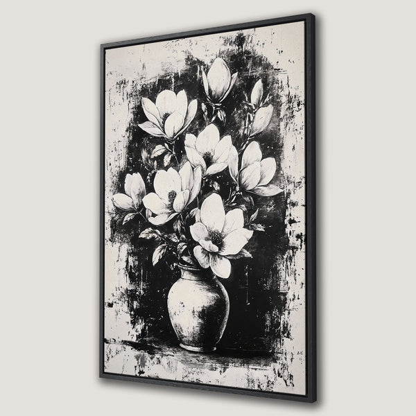 Framed Wall Art featuring a black and white abstract floral design. Modern Canvas Print of magnolia flowers in a vase, perfect for minimalist decor.