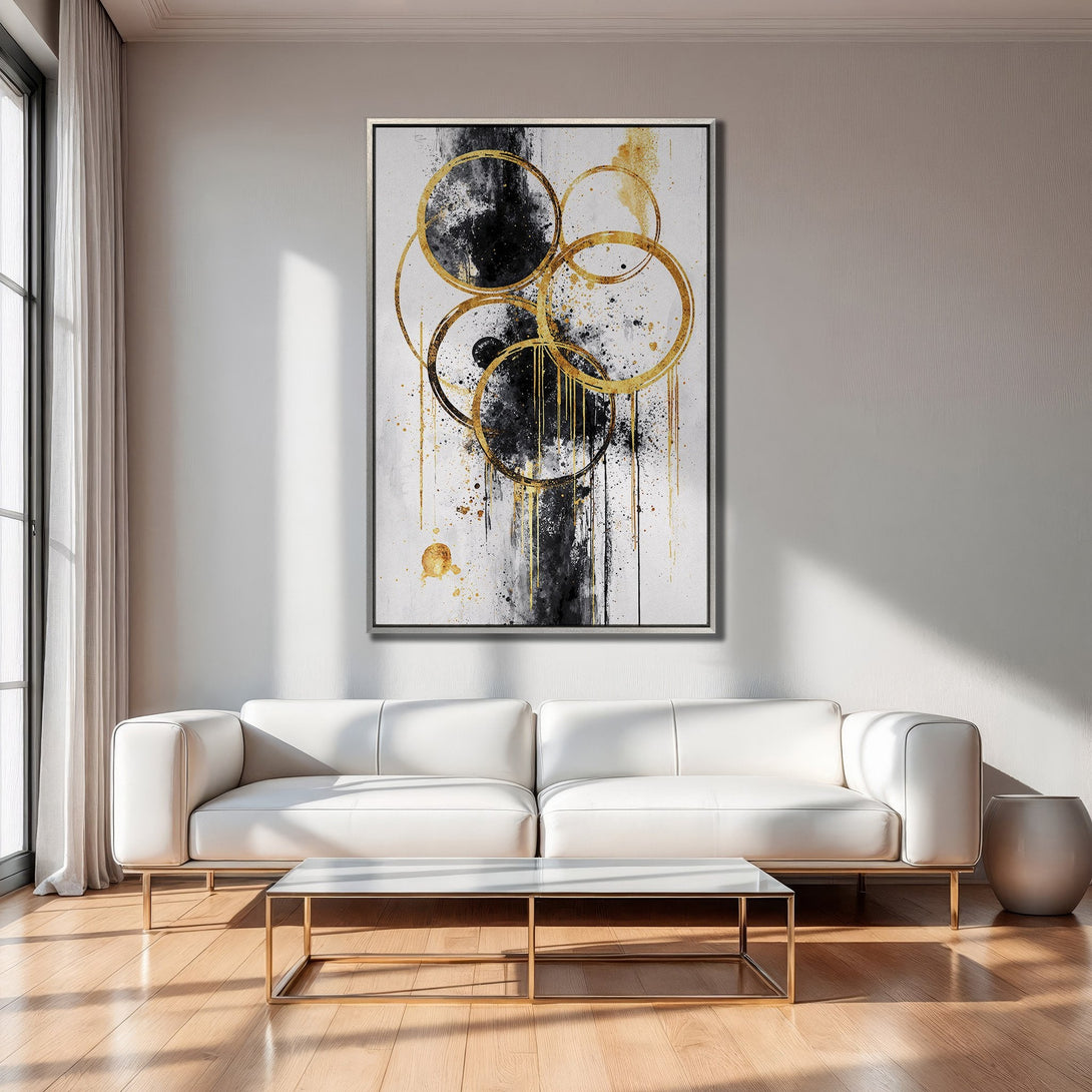 Framed Wall Art featuring abstract gold and black circles, displayed in a modern living room. Elegant decor with a neutral color palette.
