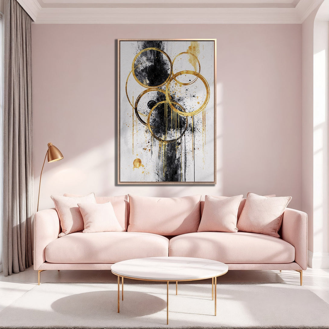 Framed Wall Art: Abstract gold & black circles Canvas Print in a modern living room. Elegant, minimalist decor with blush pink & gold accents.
