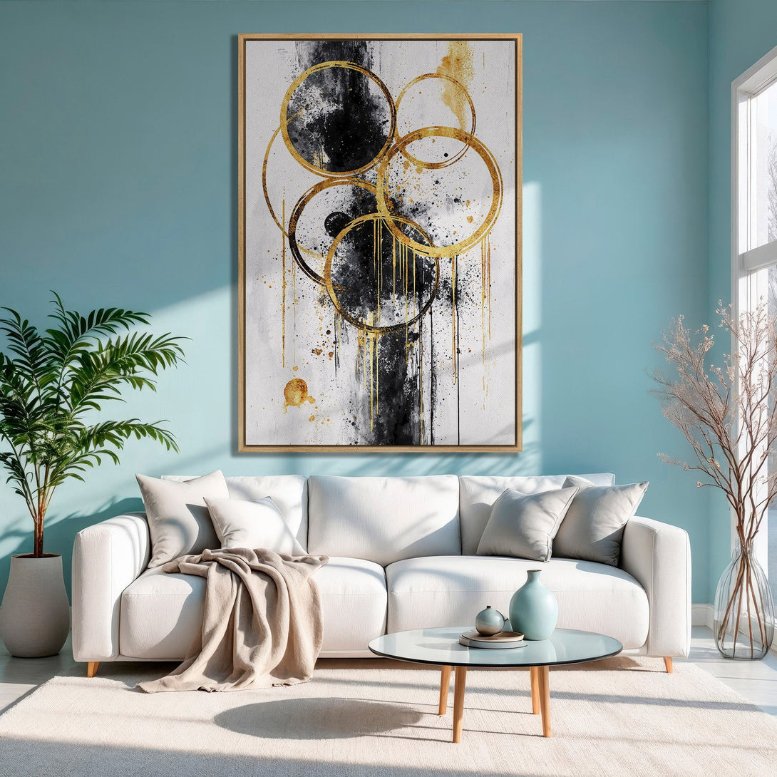 Framed Wall Art: Abstract gold and black circles Canvas Print in a modern living room. Features a neutral color palette for stylish home decor.
